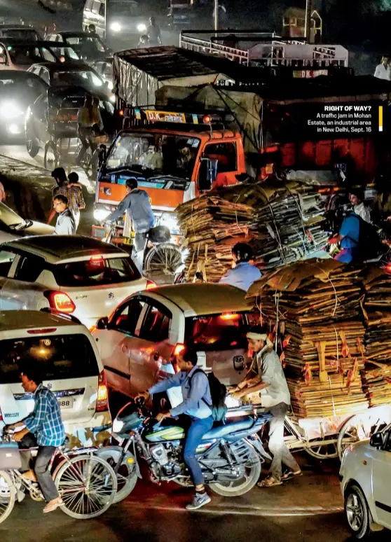  ??  ?? RIGHT OF WAY? A traffic jam in Mohan Estate, an industrial area in New Delhi, Sept. 16