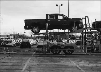  ?? CHASE CASTOR / THE NEW YORK TIMES ?? The Great Supply Chain Disruption has turned shipping terminals into volatile zones full of uncertaint­ies and best guesses, including at the Jack Cooper Transport lot in Kansas City, Kan. The lot is way station for many vehicles built at the nearby General Motors plant and elsewhere.