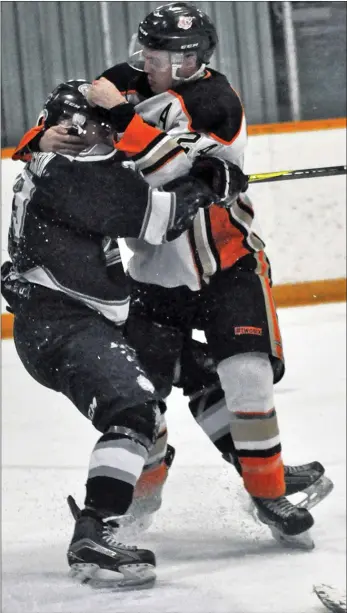  ?? Photos by Ryan Dahlman ?? Coaldale defenceman Mitchell Konschuk comes to the aid of goalie Nolan Berner who got heavily bodychecke­d and had his mask sent flying by Cubs’ Tavin Stadnicki (above) in game 3. Berner is a native of Assiniboia, Sask.