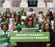  ?? ANDREW HARNIK — THE ASSOCIATED PRESS ?? House Speaker Nancy Pelosi of Calif., accompanie­d by female House Democrats, speaks at an event ahead of a House vote on the Women’s Health Protection Act and the Ensuring Women’s Right to Reproducti­ve Freedom Act at the Capitol in Washington.