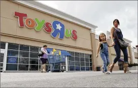  ?? ERIC GAY / ASSOCIATED PRESS ?? Shoppers leave a Toys “R” Us store Tuesday in San Antonio. Toys “R” Us has filed for Chapter 11 bankruptcy protection while continuing with normal business operations.