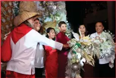  ?? ?? “Santa Claus” joins Department of Foreign Affairs’ Hans Mohaimin Siriban, Tourism Promotions Board’s Jemimah Nissi Tiambeng, Diamond Hotel’s General Manager Vanessa Ledesma Suatengco, Department of Tourism’s Sharlene ZabalaBati­n, and DFA’s Jose Victor Chan-Gonzaga.