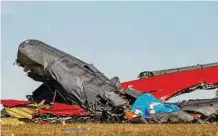  ?? Liesbeth Powers/Dallas Morning News ?? A damaged plane remains in an open field Sunday at the Dallas Executive Airport a day after the crash.