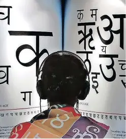  ?? MICHAEL PROBST
AP ?? A WOMAN listens to explanatio­ns on headphones about the Indian languages at the Internatio­nal Book Fair in Frankfurt, Germany. The writer says Indian languages and Arabic must be reinstated in the formal school curriculum. |