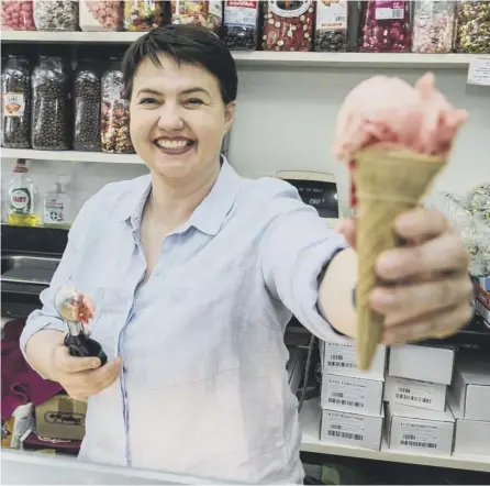  ?? PICTURE; JOHN DEVLIN ?? 0 Ruth Davidson serves up ice creams on the election campaign trail in Giffnock