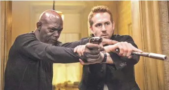  ?? JACK ENGLISH ?? The Samuel L. Jackson/Ryan Reynolds bromance is a high point of The Hitman’s Bodyguard.