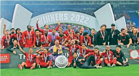  ?? — AP ?? Liverpool players celebrate after winning the FA Community Shield against Manchester City at the King Power Stadium in Leicester, England, on Saturday. Liverpool won 3-1.