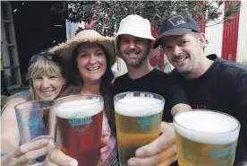  ?? MARTIN DE RUYTER/ STUFF ?? Cheers: Lauren Muncaster, left, Shona Snow, Mark Bishop and Jared Bishop at Marchfest at Founders Park, Nelson.