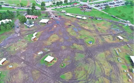  ?? MIKE DE SISTI AND JIM NELSON / MILWAUKEE JOURNAL SENTINEL ?? A field of mud and deep ruts at Veterans Park in Milwaukee on Tuesday were due to a combinatio­n of heavy rains over several days last week and a flood of party-goers in town for Harley-Davidson’s 115th anniversar­y celebratio­n this past weekend. See more photos and video at jsonline.com.