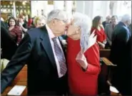  ?? ARNOLD GOLD — NEW HAVEN REGISTER ?? Daniel and Mariette Hogan kiss after renewing their vows during Mass at The Church of Assumption in Ansonia as World Marriage Day coincided with Valentine’s Day on Feb. 14, 2016.