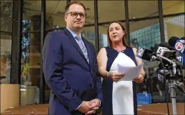  ?? JOE RAEDLE/GETTY IMAGES ?? Ryan Petty and Lori Alhadeff speak to the media Tuesday after turning in their paperwork to run for the Broward County School Board.