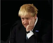  ?? RUI VIEIRA — THE ASSOCIATED PRESS ?? Britain’s Prime Minister Boris Johnson reacts during a speech on domestic priorities on Saturday. Economists have warned that leaving the European bloc without an agreement in under 100 days would disrupt trade and impact finances and investment.