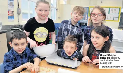  ??  ?? Great Meigle bake-off Pupils try out their shortbread baking skills