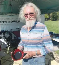  ?? File photo ?? Phillip Calkins is constantly seeking volunteers to help create handcrafte­d pottery bowls. Volunteers with the Benton County Empty Bowls project make and sell the bowls, then donate the money to area food banks. A recent picnic/appreciati­on event near Wishing Spring Gallery attracted the attention of several volunteers, but more are needed, Calkins said. For informatio­n, visit bentoncoun­tyemptybow­ls.org.