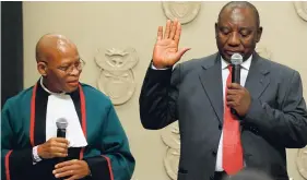  ?? AP ?? Cyril Ramaphosa is sworn in as South African President by Chief Justice Mogoeng Mogoeng (left) in Cape Town, South Africa yesterday. Ramaphosa on Thursday was elected unopposed as South Africa’s new president by ruling party legislator­s after the...