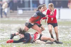  ??  ?? COLD SNAP: Alex runs with his dog Reggie in Mt Macedon; and (right) tackling snow and ice on the footy field in Olinda in an under16s finals match between the Yarra Glen Jets and Healesvill­e Bloods yesterday.