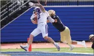  ?? TIM PHILLIS — FOR THE NEWS-HERALD ?? Mount Union’s Josh Petruccell­i (Perry) scores on a 27-yard catch and run during his team’s 37-14 win over John Carroll last September.