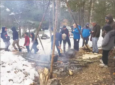  ?? The Institute For American Indian Studies, / Contribute­d photo ?? Visitors at the upcoming Maple Sugar Festival on March 9 at the Institute for American Indian Studies in Washington will learn how syrup is made by using a “stone boiling” technique.