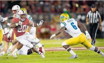  ?? Thearon W. Henderson Getty Images ?? BRYCE LOVE and Stanford scored 55 points after UCLA’s Adarius Pickett (6) was ejected from the game.