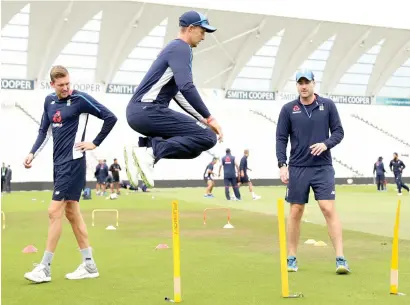  ?? — Reuters ?? Joe Root clears hurdles as part of the training on the eve of the ODI match between England and India.