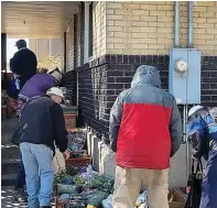  ?? (Photo by Kate Nielsen) ?? People in need have come to Shauna Devenport's front porch for free bread and produce in Salt Lake City for three decades.