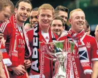  ??  ?? Nicky Low (right) with the League Cup alongside Andy Considine and Barry Robson in 2014