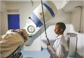  ??  ?? KHARTOUM: A patient undergoes radiothera­py at Sudan’s largest state-run cancer hospital, the Radiation and Isotopes Centre Khartoum. — AFP