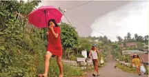  ?? Reuters ?? ■ Villagers flee as Mount Soputan volcano spews volcanic ash at Kota Menara village in South Minahasa, North Sulawesi yesterday.