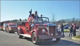  ?? LAUREN HALLIGAN - MEDIANEWS GROUP ?? Santa Clauswaves to attendees at the 2020 Convoy for Tots in Saratoga Springs.