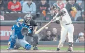  ?? KARL MONDON — BAY AREA NEWS GROUP FILE ?? The San Francisco Giants’ Buster Posey strokes a double against the Los Angeles Dodgers in the first inning of Game 5 of the National League Divisional Series at Oracle Park in San Francisco on Thursday, Oct. 14.