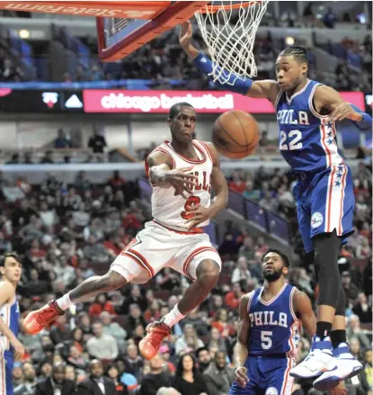  ?? | PAUL BEATY/ AP ?? Rajon Rondo, who had 10 assists, whips a pass beyond 76ers forward Richaun Holmes in the second half Sunday.