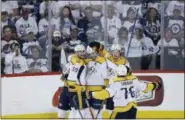  ?? JOHN WOODS — THE CANADIAN PRESS VIA AP ?? Nashville Predators’ Roman Josi (59), Viktor Arvidsson (33), Filip Forsberg (9), Ryan Johansen (92) and P.K. Subban (76) celebrate Forsberg’s goal against the Winnipeg Jets during the third period Monday.