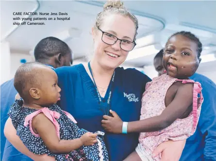  ??  ?? CARE FACTOR: Nurse Jess Davis with young patients on a hospital ship off Cameroon.