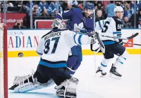  ?? NATHAN DENETTE THE CANADIAN PRESS ?? Maple Leaf centre Nazem Kadri tips a shot just wide Saturday in Toronto.The Leafs bounced back from a 2-0 third-period deficit to Winnipeg, winning the game, 3-2.