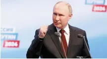  ?? Reuters-Yonhap ?? Russian President Vladimir Putin speaks at a visit to his campaign headquarte­rs after the presidenti­al election in Moscow, early Monday.