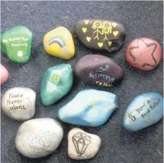  ??  ?? Kind and caring messages painted on rocks. PHOTO: Supplied.