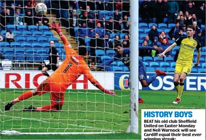  ?? REX ?? Out of reach: Cardiff winger Nathaniel Mendez-Laing fires past Burton goalkeeper Stephen Bywater to put his side 2-1 up