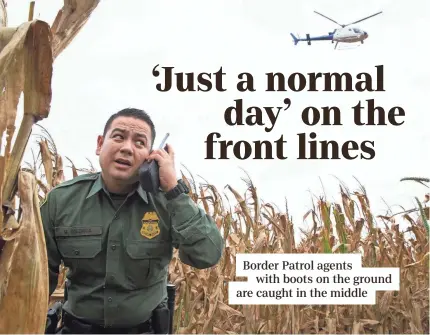  ?? COURTNEY SACCO/USA TODAY NETWORK ?? Border Patrol Agent Marcelino Medina, on patrol for border crossings near Granjeno, Texas, takes directions from a Marine helicopter.