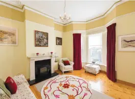  ??  ?? The drawing room has a bay window and a solid-fuel stove. Left, the Victorian cottage is split-level