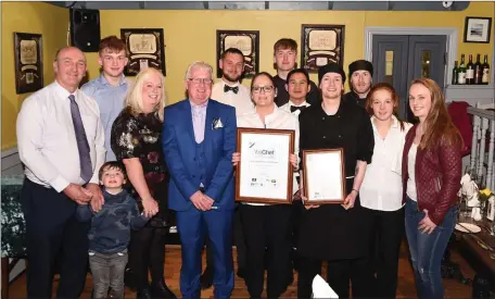  ??  ?? The Houlihan family Sean and Sinead with Fódhla, Cian, Keelin and Sean Junior with Yes Chef Nick’s Seafood and Gastro Bar Award with staff members Bill Tobin, Enda Sweeney, Clodagh Sugrue, Jun Rodis, Lucy Knight, Daithi Roche, Shane Griffin at Nick’s Restaurant Killorglin.Photo by Michelle Cooper Galvin