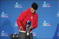  ?? ROSS D. FRANKLIN — THE ASSOCIATED PRESS ?? Kansas City Chiefs quarterbac­k Patrick Mahomes points to the MVP trophy prior to a news conference Monday in Phoenix.