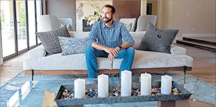  ?? Jesse Goddard For The Times ?? COMIC ACTOR Rob Riggle says that before the Westlake Village home’s transforma­tion by his designer wife, Tiffany, the back resembled a “Soviet-bloc schoolhous­e.”