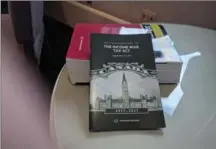  ?? , PHOTO COURTESY JANIS CRIGER ?? Local lawyers threw a 100th birthday party for Canada’s income tax act in the John Sopinka Court House. It featured a copy of the original tax act, which isa fraction of the size of today’s 11-pound act.