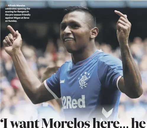  ??  ?? 3 Alfredo Morelos celebrates opening the scoring for Rangers in the pre-season friendly against Wigan at Ibrox on Sunday.