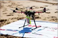  ?? AP PHOTO VIA WESTPAC LITTLE RIPPER ?? This Dec. 9 photo shows the Westpac Little Ripper UAV and Rescue Pod at Bilgola Beach in New South Wales, Australia. A flying drone has dropped a flotation device to two teens caught in a riptide in heavy seas off the Australian coast Thursday in what...