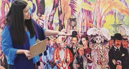  ?? Tyler Sizemore/Staff photograph­er ?? Spanish teacher Jessica Maxan describes Diego Rivera’s mural “Dream of a Sunday Afternoon in Alameda Park” on Oct. 11 at Eastern Middle School in Greenwich, Conn., to mark the end of Hispanic Heritage Month.