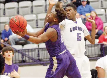  ?? MARK BUFFALO/RIVER VALLEY & OZARK EDITION ?? Central Arkansas Christian’s Kam Vick goes past Lonoke defender Tyriqe Jackson during action last year.