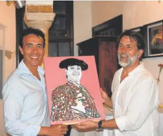  ?? ?? López Palazuelo con el torero Victor Puerto y una de las obras // GERARDO MORILLO