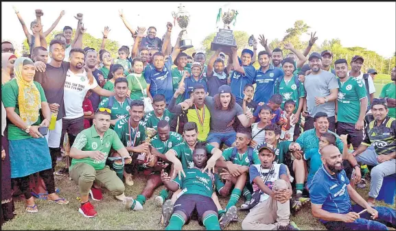  ?? Picture: REINAL CHAND ?? Members of the Mulomulo Sydney Highlander­s team celebrate with fans after winning the FANCA Tournament at Prince Charles Park in Nadi yesterday.