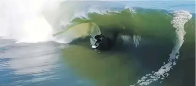  ??  ?? Koa Smith, right, surfed for two minutes on a wave off Namibia, above, passing through eight barrels.